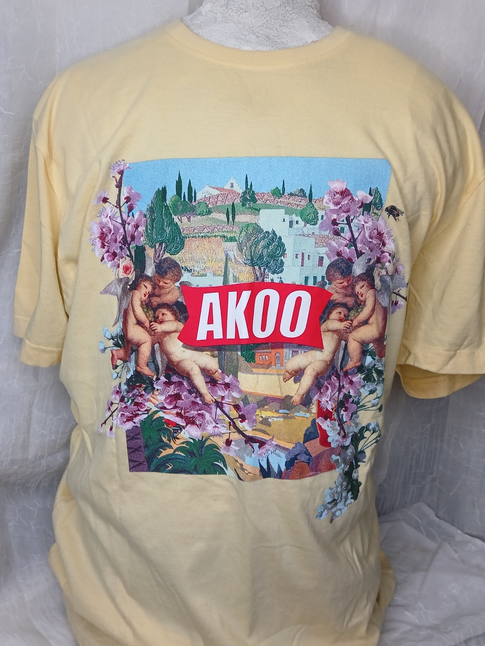 AKOO Graphic Logo Tee — Red and White on Multicolor Print